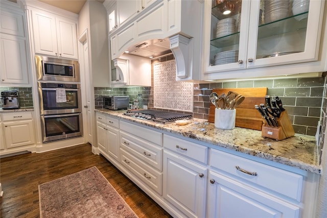 4207 Pearl Crescent Ln, Arlington, TX 76005 - kitchen featuring white cabinetry, stainless steel appliances, tasteful backsplash, and light stone countertops