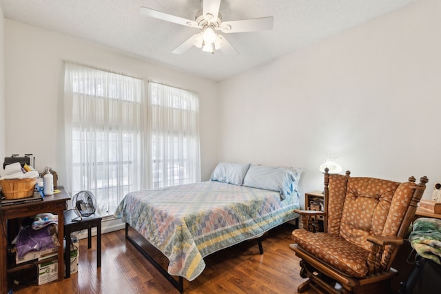 6419 Shadow Ln, Dallas, TX 75236 - bedroom featuring wood finished floors, a baseboard heating unit, and ceiling fan