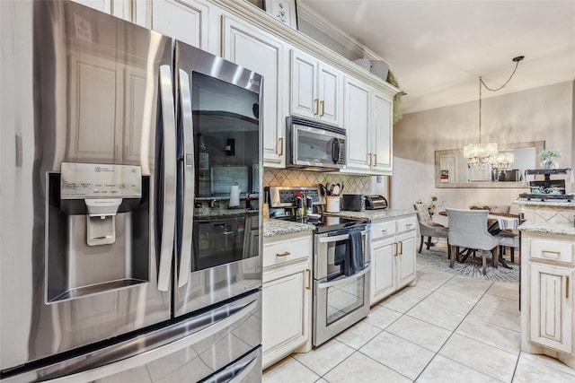 301 Shepherd Ln, Royse City, TX 75189 - kitchen featuring stainless steel appliances, crown molding, decorative backsplash, a chandelier, and decorative light fixtures
