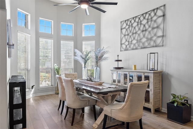 301 Shepherd Ln, Royse City, TX 75189 - dining space featuring a ceiling fan, wood finished floors, baseboards, and a high ceiling