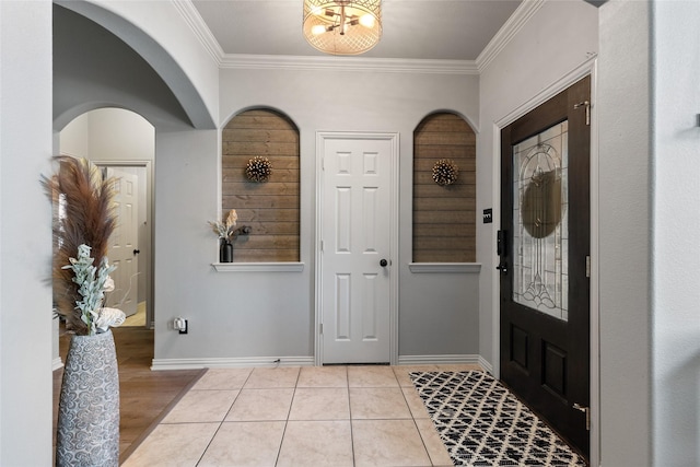 301 Shepherd Ln, Royse City, TX 75189 - foyer entrance with crown molding, baseboards, arched walkways, and a chandelier