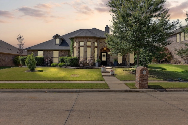301 Shepherd Ln, Royse City, TX 75189 - french provincial home featuring a front yard, stone siding, a chimney, and brick siding