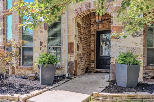 301 Shepherd Ln, Royse City, TX 75189 - doorway to property featuring stone siding