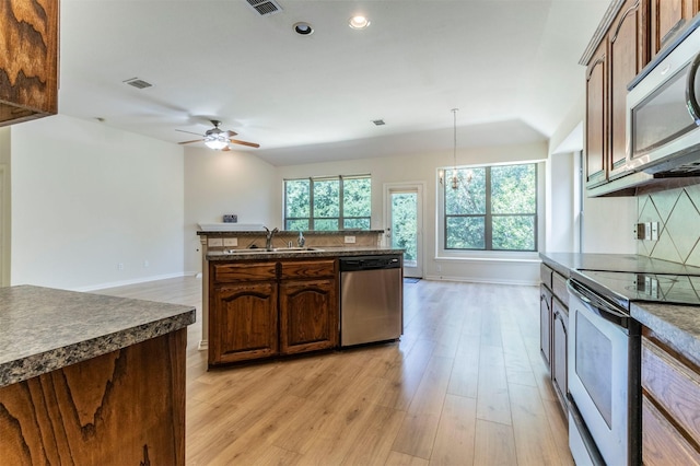 1716 Lake Way Dr, Little Elm, TX 75068 - kitchen with appliances with stainless steel finishes, a sink, dark countertops, baseboards, and recessed lighting