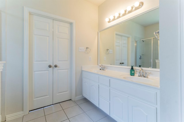 1716 Lake Way Dr, Little Elm, TX 75068 - bathroom with tile patterned floors, a stall shower, double vanity, and baseboards