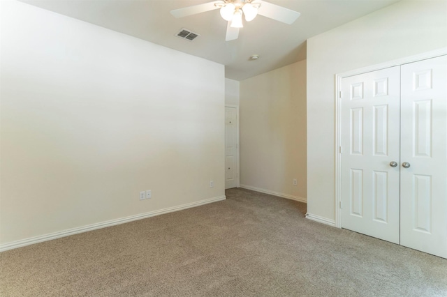 1716 Lake Way Dr, Little Elm, TX 75068 - unfurnished bedroom with light carpet, baseboards, a closet, and a ceiling fan