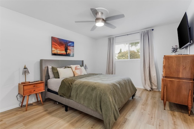 5845 E University Blvd Unit A, Dallas, TX 75206 - bedroom featuring light wood-style flooring, baseboards, and a ceiling fan