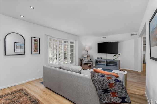 5845 E University Blvd Unit A, Dallas, TX 75206 - living area featuring light wood finished floors, baseboards, and recessed lighting
