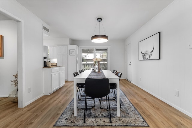 5845 E University Blvd Unit A, Dallas, TX 75206 - dining area with light wood-style flooring and baseboards