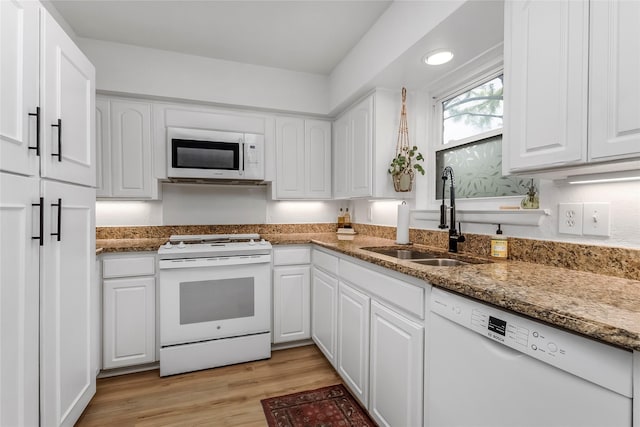 5845 E University Blvd Unit A, Dallas, TX 75206 - kitchen featuring white appliances, a sink, white cabinets, stone counters, and light wood finished floors
