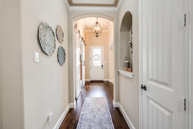 5912 Trail Marker Ct, Fort Worth, TX 76123 - doorway to outside featuring crown molding, dark wood-style floors, arched walkways, a chandelier, and baseboards