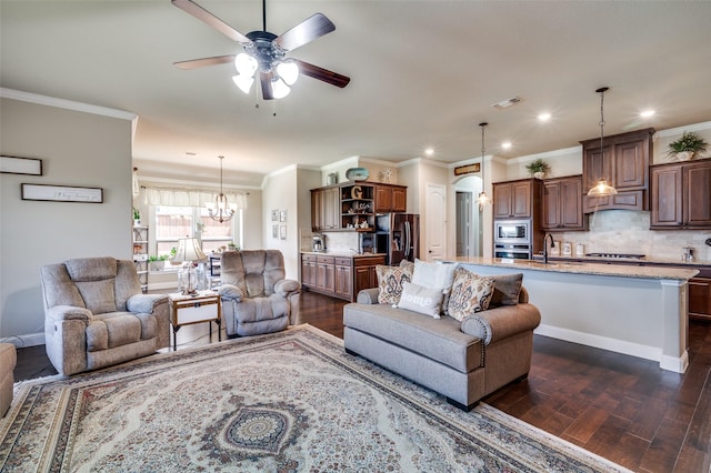 5912 Trail Marker Ct, Fort Worth, TX 76123 - living area featuring dark wood-style floors, a ceiling fan, a chandelier, ornamental molding, and recessed lighting
