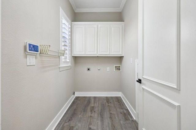 laundry area featuring electric dryer hookup, cabinet space, hookup for a washing machine, baseboards, and dark wood-style floors
