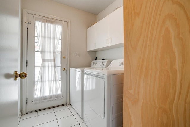 1409 Robyn Rd, Azle, TX 76020 - clothes washing area featuring washing machine and clothes dryer, cabinet space, and light tile patterned floors