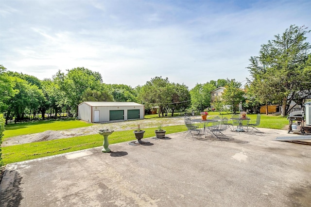 1409 Robyn Rd, Azle, TX 76020 - view of patio with an outdoor structure and a detached garage