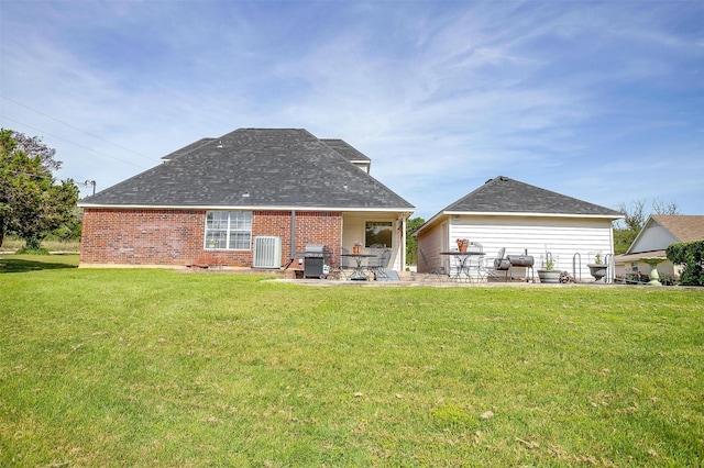 1409 Robyn Rd, Azle, TX 76020 - rear view of house featuring brick siding, a yard, a patio area, cooling unit, and roof with shingles