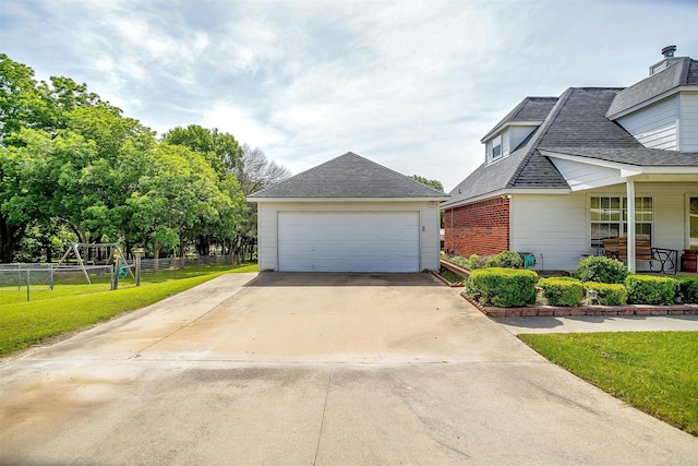 1409 Robyn Rd, Azle, TX 76020 - view of front facade with a garage, covered porch, a shingled roof, and an outbuilding