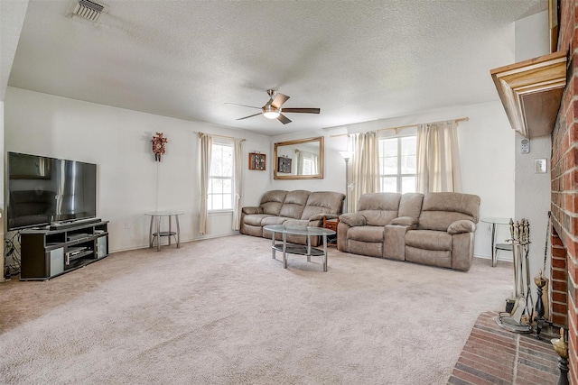 1409 Robyn Rd, Azle, TX 76020 - carpeted living area featuring a ceiling fan and a textured ceiling