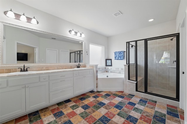 111 Blue Stem Ln, Aledo, TX 76008 - full bathroom featuring a stall shower, double vanity, a bath, stone finish floors, and recessed lighting