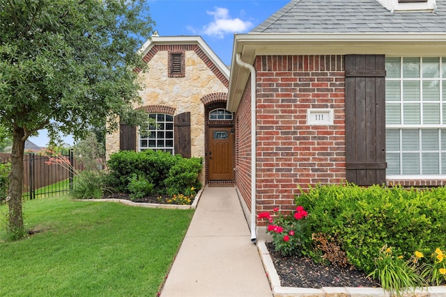 111 Blue Stem Ln, Aledo, TX 76008 - view of exterior entry with brick siding, a shingled roof, and stone siding