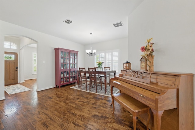 111 Blue Stem Ln, Aledo, TX 76008 - dining space with arched walkways, a chandelier, wood finished floors, and baseboards