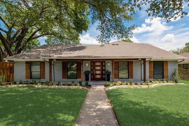 9178 Glen Springs Dr, Dallas, TX 75243 - view of front of home featuring brick siding and a front yard