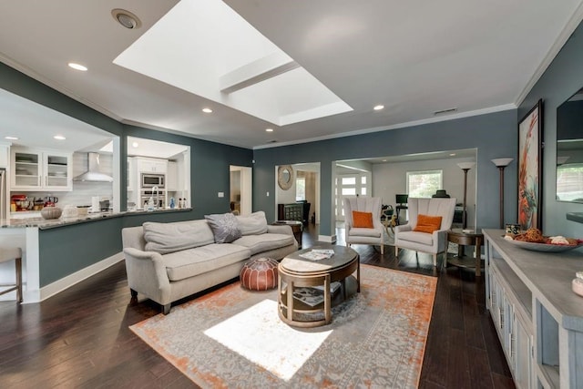 9178 Glen Springs Dr, Dallas, TX 75243 - living room with crown molding, a skylight, dark wood finished floors, and recessed lighting
