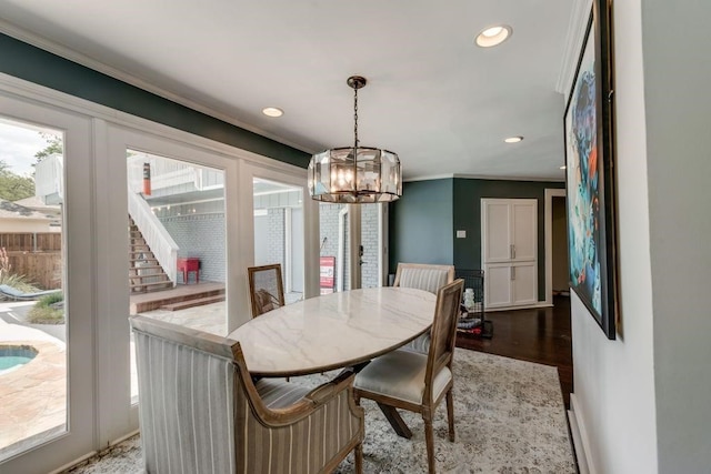 9178 Glen Springs Dr, Dallas, TX 75243 - dining area featuring a chandelier, recessed lighting, wood finished floors, crown molding, and baseboards