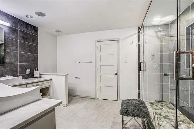 9178 Glen Springs Dr, Dallas, TX 75243 - bathroom featuring vanity and a stall shower