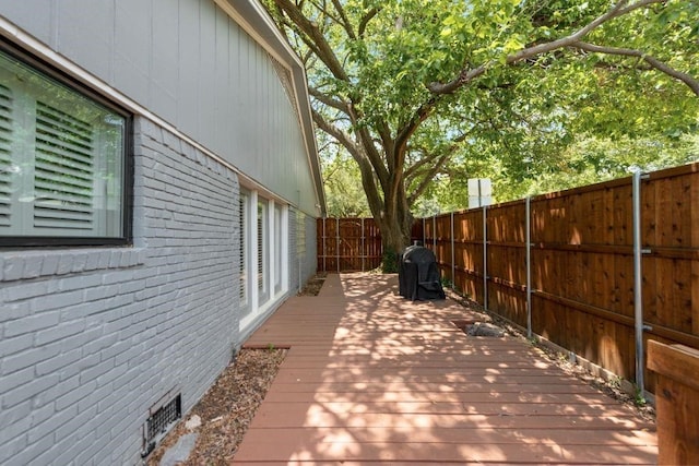 9178 Glen Springs Dr, Dallas, TX 75243 - deck featuring a fenced backyard and a grill