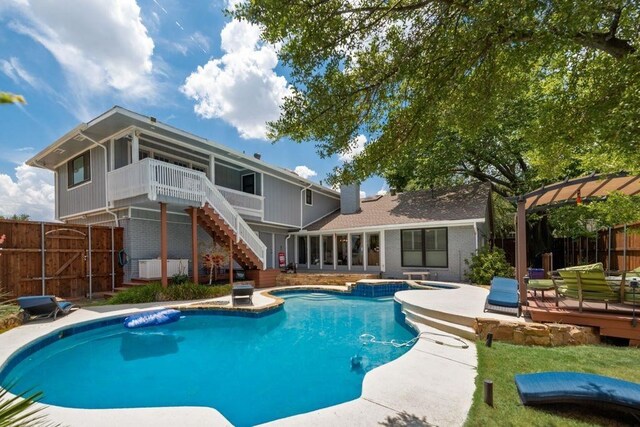 9178 Glen Springs Dr, Dallas, TX 75243 - view of swimming pool with a deck, a sunroom, a fenced backyard, and stairs