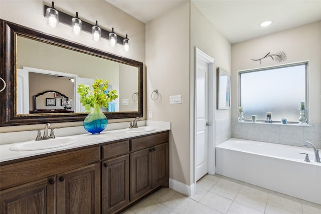 619 Comal Dr, Crandall, TX 75114 - bathroom with tile patterned floors, double vanity, and a bath