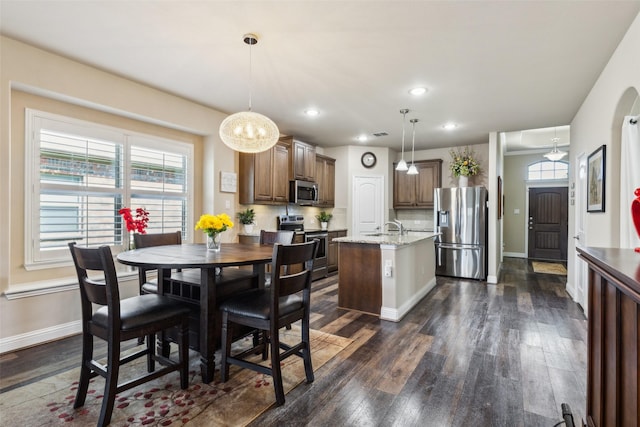 619 Comal Dr, Crandall, TX 75114 - dining room featuring dark wood finished floors, baseboards, and recessed lighting