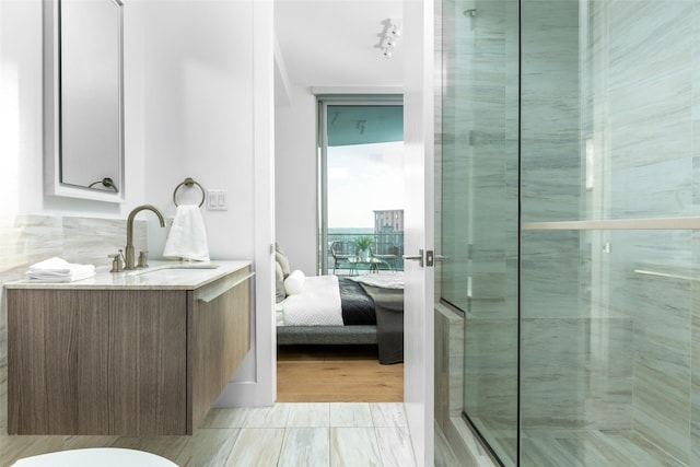 3130 N Harwood St Unit 903, Dallas, TX 75201 - full bath with ensuite bath, a stall shower, and vanity