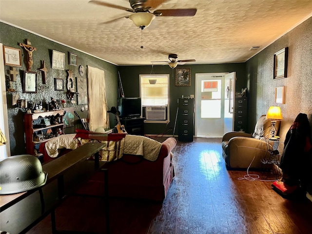 711 Fayette St, Nocona, TX 76255 - living room with ceiling fan, hardwood / wood-style floors, a textured wall, and a textured ceiling