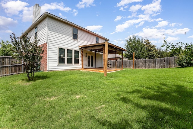 9305 Manassas Rdg, Mckinney, TX 75071 - back of house with a chimney, brick siding, and a patio area