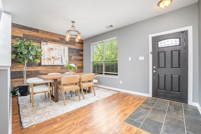 9305 Manassas Rdg, Mckinney, TX 75071 - dining space with wood walls, baseboards, and wood finished floors