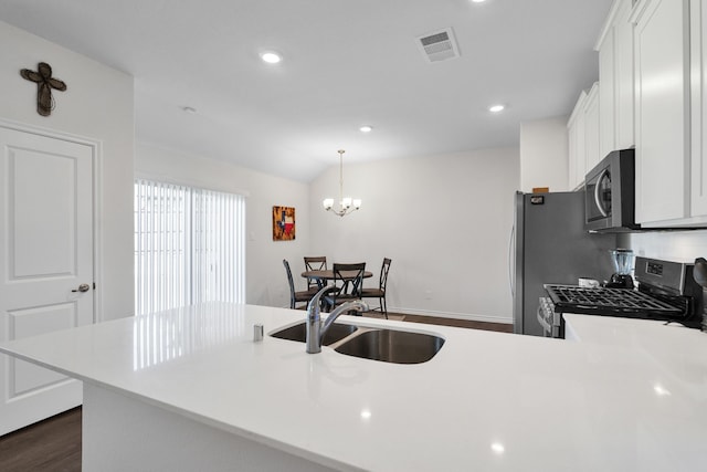 2346 Neff Ln, Forney, TX 75126 - kitchen featuring stainless steel appliances, a sink, light countertops, dark wood-type flooring, and white cabinets