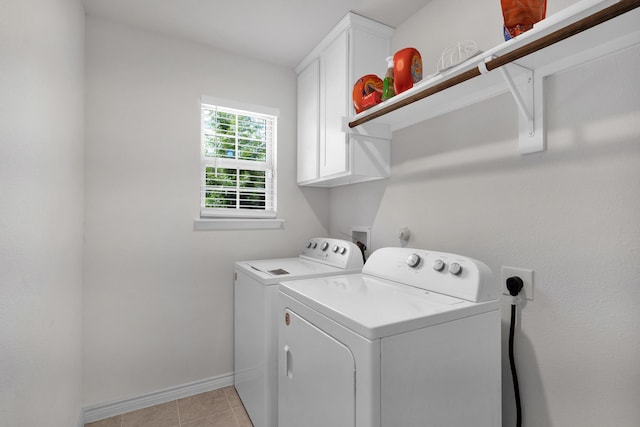 2346 Neff Ln, Forney, TX 75126 - laundry room with washing machine and clothes dryer, cabinet space, baseboards, and light tile patterned floors