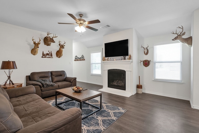 2346 Neff Ln, Forney, TX 75126 - living area with a ceiling fan, dark wood finished floors, a glass covered fireplace, baseboards, and lofted ceiling