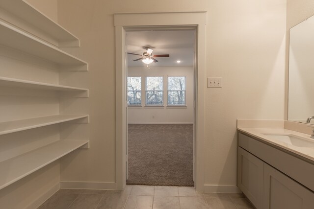 2506 Sun Grove Rd, Melissa, TX 75454 - bathroom with a ceiling fan, baseboards, tile patterned floors, and vanity