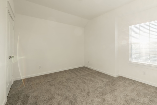 2506 Sun Grove Rd, Melissa, TX 75454 - empty room with carpet flooring, lofted ceiling, and baseboards