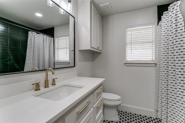 203 Oak Valley Dr, Colleyville, TX 76034 - full bath with toilet, vanity, a shower with shower curtain, baseboards, and tile patterned flooring