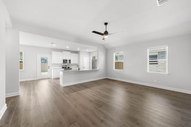 1005 Pecan Pl, Hutchins, TX 75141 - unfurnished living room with a sink, dark wood-type flooring, ceiling fan, baseboards, and recessed lighting
