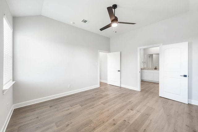 1005 Pecan Pl, Hutchins, TX 75141 - unfurnished bedroom featuring light wood-style floors, lofted ceiling, and baseboards