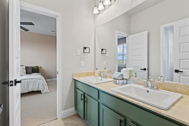 3204 Creek Meadow Dr, Anna, TX 75409 - ensuite bathroom featuring double vanity, tile patterned floors, and baseboards