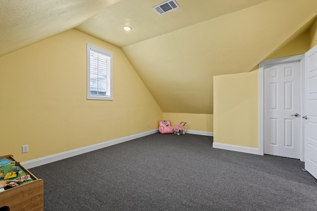 3204 Creek Meadow Dr, Anna, TX 75409 - additional living space with vaulted ceiling, dark carpet, and baseboards