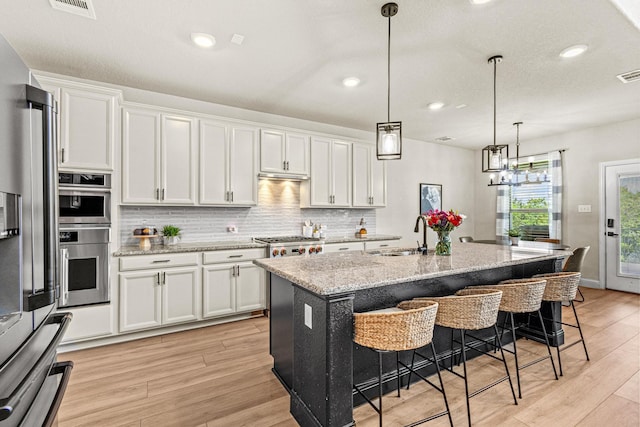 3204 Creek Meadow Dr, Anna, TX 75409 - kitchen featuring light wood-style flooring, a sink, white cabinets, and recessed lighting