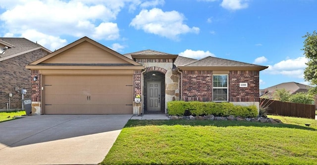 1302 Copper St, Princeton, TX 75407 - view of front of home with concrete driveway, a garage, brick siding, and stone siding