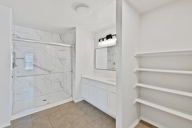 1302 Copper St, Princeton, TX 75407 - full bath featuring a marble finish shower, vanity, tile patterned flooring, and baseboards